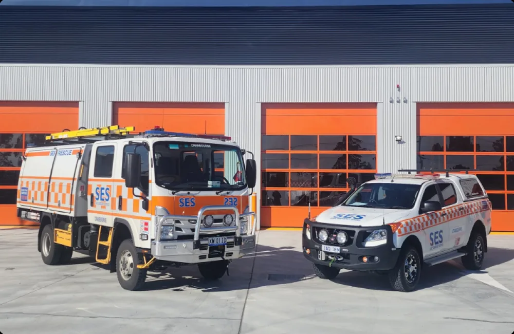 VICSES rescue truck and response vehicle outside a unit facility